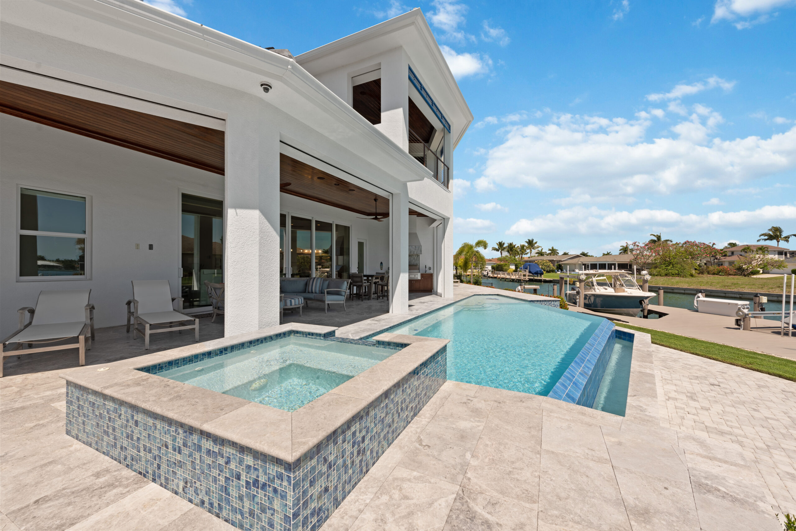 Image of swimming pool and outdoor space to convey why you should move forward with Custom Homes Naples - R.K.Reiman