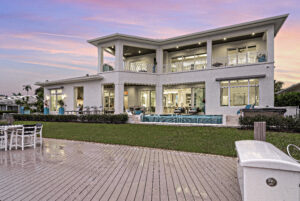 Aerial image of a luxury home to convey the best Custom Luxury Homes on the Paradise Coast in Florida